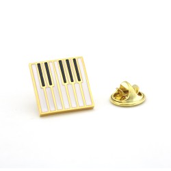 Приколка на піджак у вигляді клавіш золоті